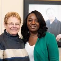 Lynn Blue posing with a guest at the Lynn M. Blue Connection Naming Ceremony